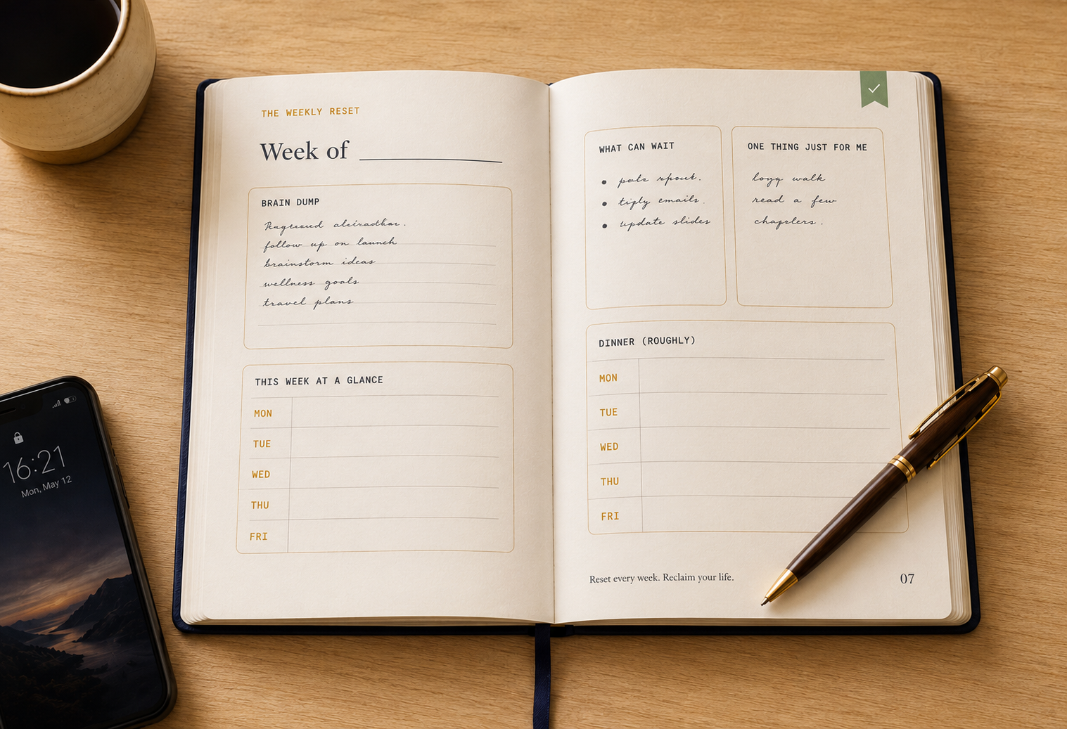 The Weekly Reset planner opened to a filled-in spread with a pen and coffee
